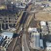 Oblique aerial view of the M74 extension going through the Polamadie area to the M74 centred on Gushetfaulds railway junction, taken from the SE.