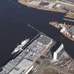 Oblique aerial view centred on the Royal Yacht Britannia, looking N.