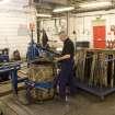 Interior view of Dundashill Cooperage, Glasgow. Cask Rebuild Process. Jamie O' Hare, a cooper for 41 years, building or 'rising' a cask. To his right, the unpacked ex-bourbon barrel oak staves bought in from the USA. Cask shell build nearing completion. The windlass has been applied and tigtened to allow the end or chime hoop to be hammered on. The cask now has more of a 'barrel' shape.