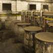Interior.  Cask Rebuild Process. Steam Pans 1 and 2 (background). Steaming causes the cask shell to swell up and force the oak staves. If a cask was kept dry during building it would not be watertight.