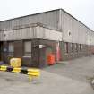 General view of cooperage from SW. The main cooperage area begins beyond the four windows.
