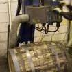 Interior. Cask Rebuilding Process. Bung Hole Borer. The bung hole has been drilled after the frist hoop drive.This machine has an extractor to remove the wood dust and shavings. The cask is still warm from charring (rejuvination) or steaming (rebuild) at this point.This drilling machine has an extractor to remove the wood dust and shavings.