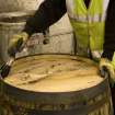 Interior. Cask Rebuilding or Rejuvination Process. Cask has wax painted on the head where it meets the chime at the croze. This replaces the use of flags or reeds.