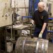 Interior. Cask Rebuilding and Rejuvination Process. Cask Testing. A cask being tested after its second hoop drive for watertightness. Here, the cooper is hammering in the bung hole in after adding water .