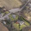 Oblique aerial view centred on the church, taken from the NW.