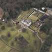 Oblique aerial view centred on the country house, taken from the NE.