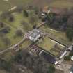 Oblique aerial view centred on the country house, taken from the NW.