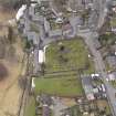 Oblique aerial view centred on the graveyard, taken from the ENE.