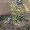 Oblique aerial view centred on the kirk with the burial ground adjacent, taken from the NNW.