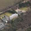 Oblique aerial view centred on the house with the college adjacent, taken from the NNE.