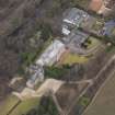 Oblique aerial view centred on the house with the college adjacent, taken from the SSW.