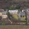 Oblique aerial view centred on the house with the college adjacent, taken from the SSE.