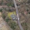 Oblique aerial view centred on the house with the road bridge adjacent, taken from the NE.