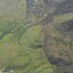 Oblique aerial view of the remains of Dun Beag fort and the adjacent field banks, taken from the E.