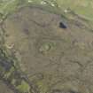 Oblique aerial view of the remains of Dun Colbost broch, taken from the S.