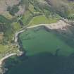 Oblique aerial view of Ardarroch and Ardoch centred on the fish traps in the bay, taken from the WNW.