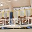 Interior view looking up at the balcony railings and changing cubicles from poolside, Clydebank public baths and swimming pool.