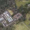 Oblique aerial view centred on the stable block with the walled garden adjacent, taken from the W.