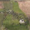 Oblique aerial view centred on the country house with the Home Farm adjacent,  taken from the SSE.