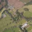 Oblique aerial view centred on the country house with the formal garden adjacent, taken from the SW.