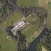 Oblique aerial view centred on the country house with the formal garden adjacent, taken from the SSW.