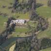 Oblique aerial view centred on the country house with the formal garden adjacent, taken from the SSE.