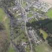 Oblique aerial view centred on the village, taken from the W.