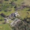 Oblique aerial view centred on the hotel with the stable block adjacent, taken from the WSW.