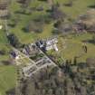 Oblique aerial view centred on the hotel with the stable block adjacent, taken from the SW.