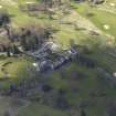 Oblique aerial view centred on the hotel with the stable block adjacent, taken from the NE.