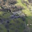 Oblique aerial view centred on the hotel with the stable block adjacent, taken from the NNE.