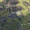 Oblique aerial view centred on the hotel with the stable block adjacent, taken from the NNE.