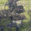 Oblique aerial view centred on the hotel with the stable block adjacent, taken from the N.