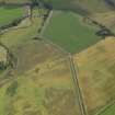 Oblique aerial view of the cropmarks of the unenclosed round houses, pits and rig, taken from the N.