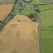 General oblique aerial view of Sprouston village and the cropmarks, taken from the ENE.