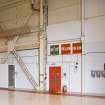 Interior.  Detail of fire point signs, electric switch panel and side framework of unprotected C type aircraft hangar (E).