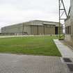 View from SSE of unprotected C type aircraft hangar with part of J type hangar door in the foreground.