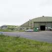 General view from SSW showing the two L type aircraft hangars both with grass covered concrete roofs in the SW dispersal area.