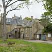 View from N of house with later external stairway and servants annexe.
