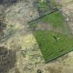 Oblique aerial view of the remains of the buildings, rig and field at Breac-Achadh, taken from the SSE.