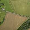 Oblique aerial view of the cropmarks of the field boundary, taken from the SSW.