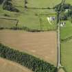 Oblique aerial view of the cropmarks of the field boundary, taken from the ESE.