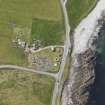 Oblique aerial view centred on the excavated broch and settlement at Old Scatness, Sumburgh, and the visitor attraction, taken from the N.