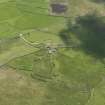 Oblique aerial view of Clumlie broch and township, looking to the ESE.