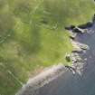 Oblique aerial view centred on the Broch of Mousa with The Haa and the burnt mound adjacent, taken from the NNW.