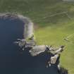 Oblique aerial view centred on the Broch of Mousa with The Haa adjacent, taken from the SW.