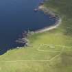 General oblique aerial view centred on the Broch of Mousa with The Haa adjacent, taken from the S.