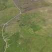 Oblique aerial view of the farmsteads at Skelpigarth, looking N.