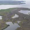 General oblique aerial view of Papa Stour with the West Mainland beyond, looking SE.