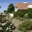 Site of conservatory and S end of house, view from E